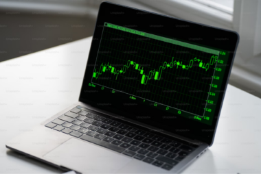 a laptop with a Candlestick Charts