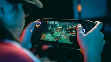 A person playing a video game on a handheld gaming console