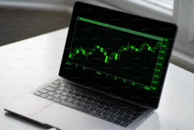 a laptop with a Candlestick Charts